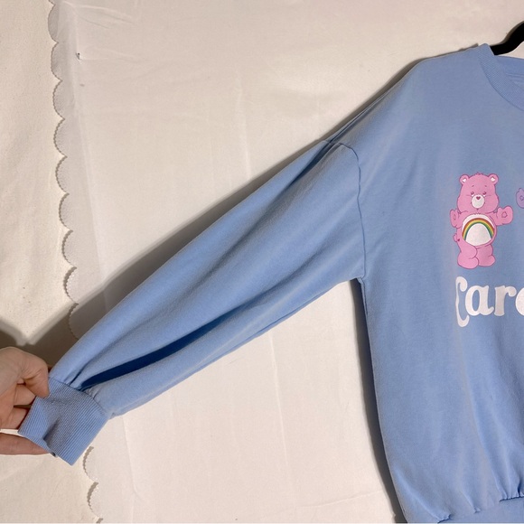 Care Bears Oversized Light Blue Care Bear Graphic Sweatshirt Crew Neck XS - Picture 12 of 16